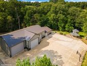 This House comes with a Hidden Man Cave and at least a 10 Car Garage