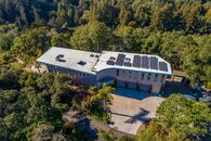 Custom, contemporary 10 year old home nestled on top of over 3 acres with an unobstructed valley & ocean views
