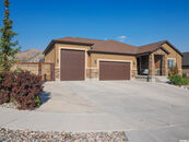 Herriman, Utah is home to this 4 Car Garage House with Car Lift and RV Parking