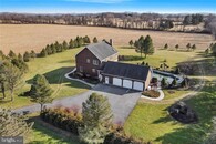 Private Custom Farmhouse set on 107+ acres with 50+ car garages