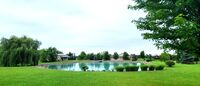 9 Car Garage spaces, Fantastic House with a Pond on 4.32 Beautifully Landscaped Acres
