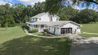 11 Car Garage and Workshop on 10 acres with Custom Built Home in Summerfield, FLORIDA. A car collectors or hobbyists dream!