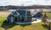 9 Car Garage Custom Built Home with Pool, it's Fully Stocked Fishing Pond