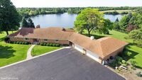 8 Car Garage and Breathtaking 90 acres including your own private 24-acre lake